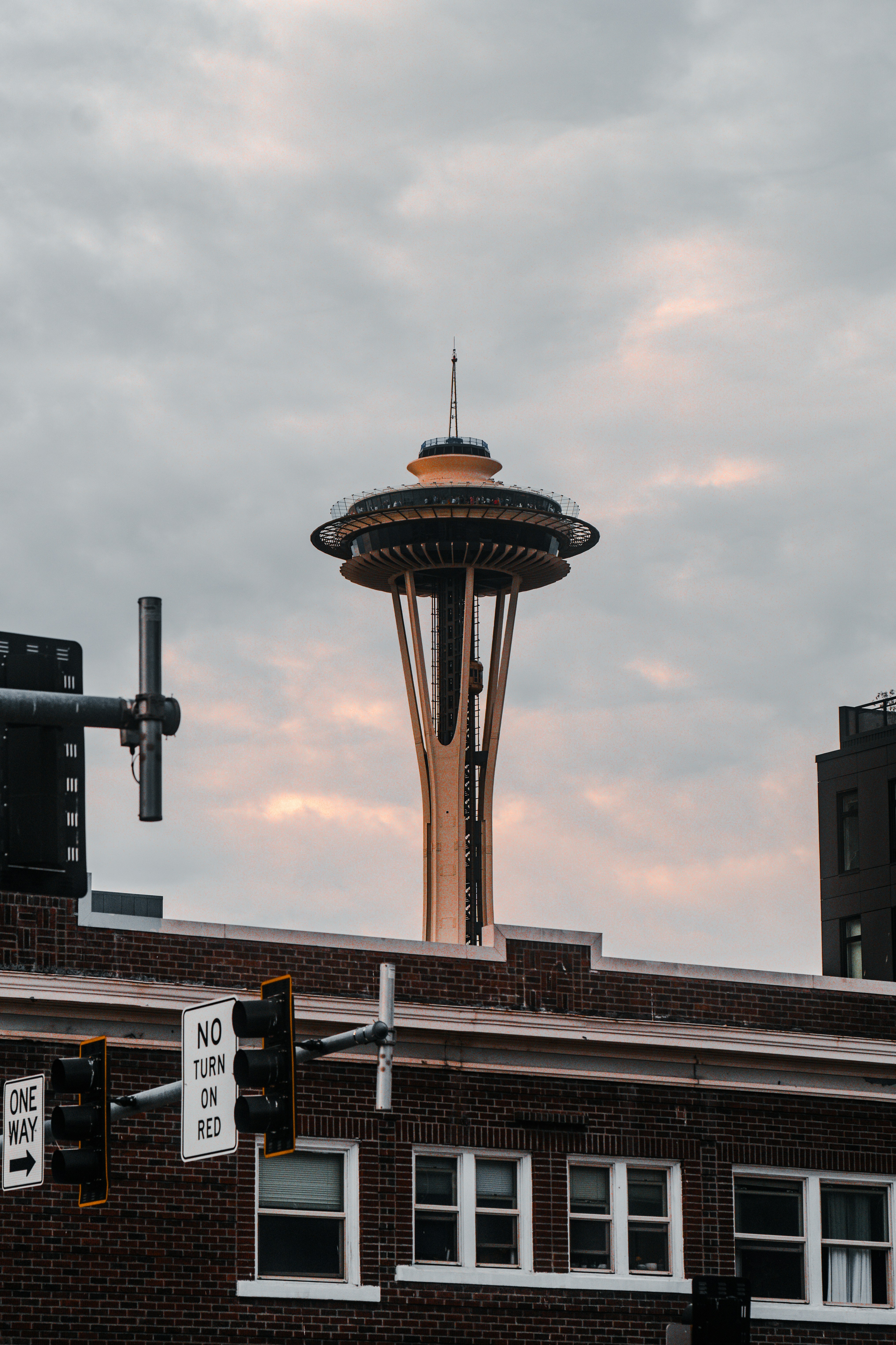 A very tall building with a very tall tower in the background