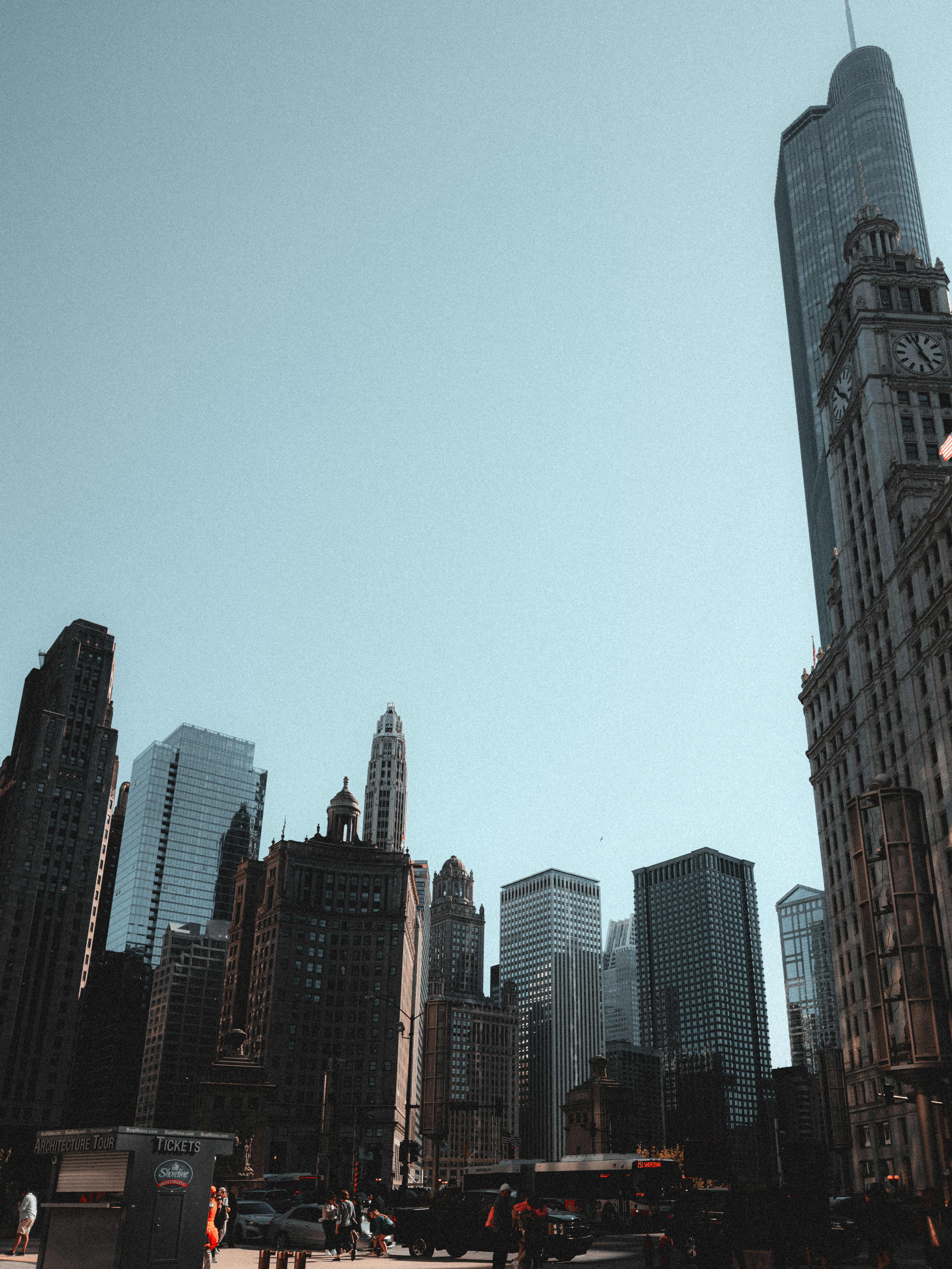 A person is flying a kite in a big city