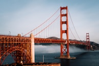 The golden gate bridge is surrounded by fog