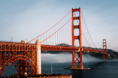 The golden gate bridge is surrounded by fog