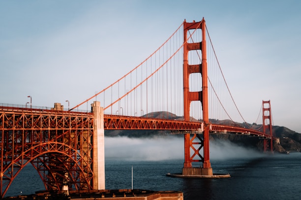 The golden gate bridge is surrounded by fog