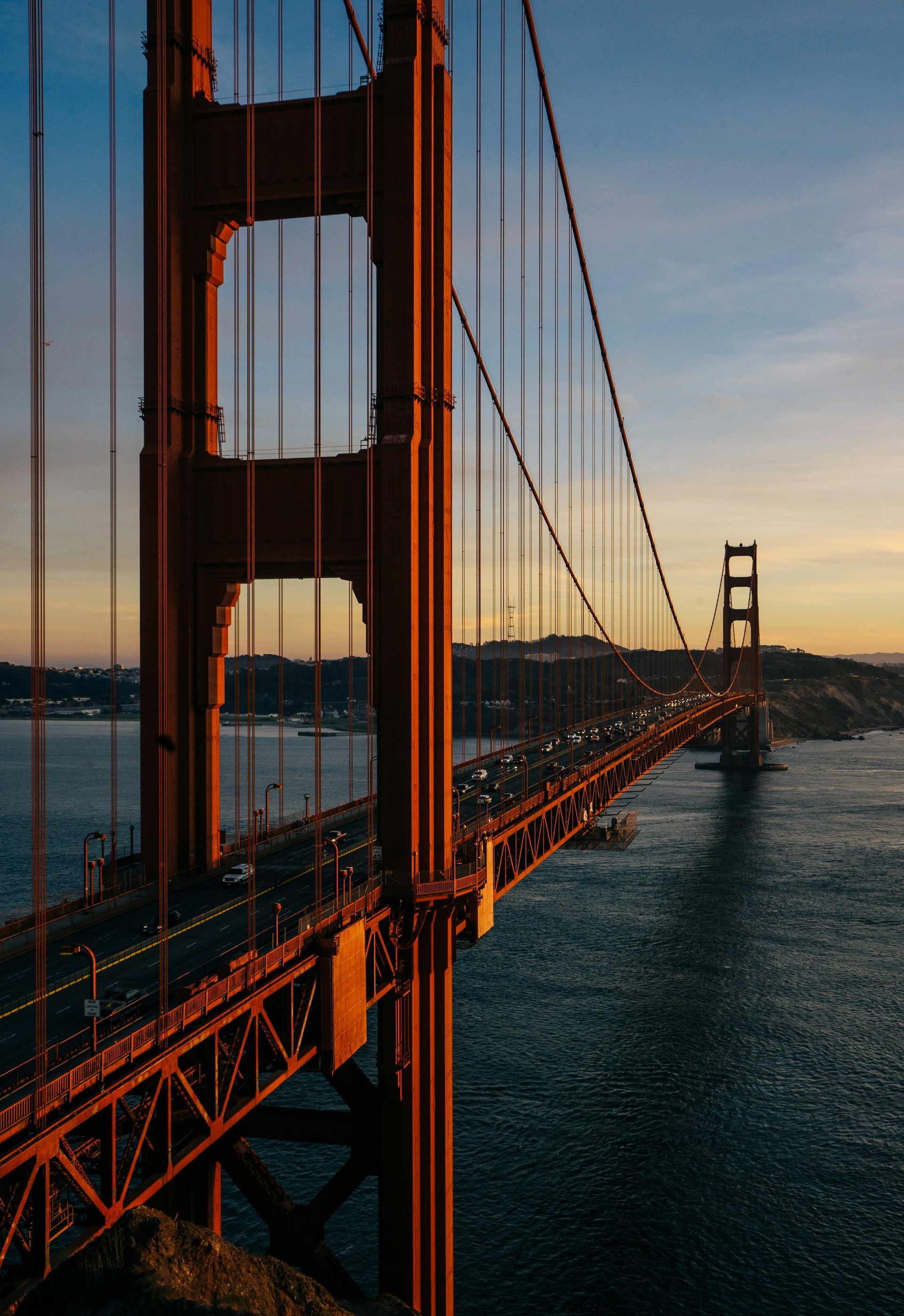 A view of the golden gate bridge at sunset