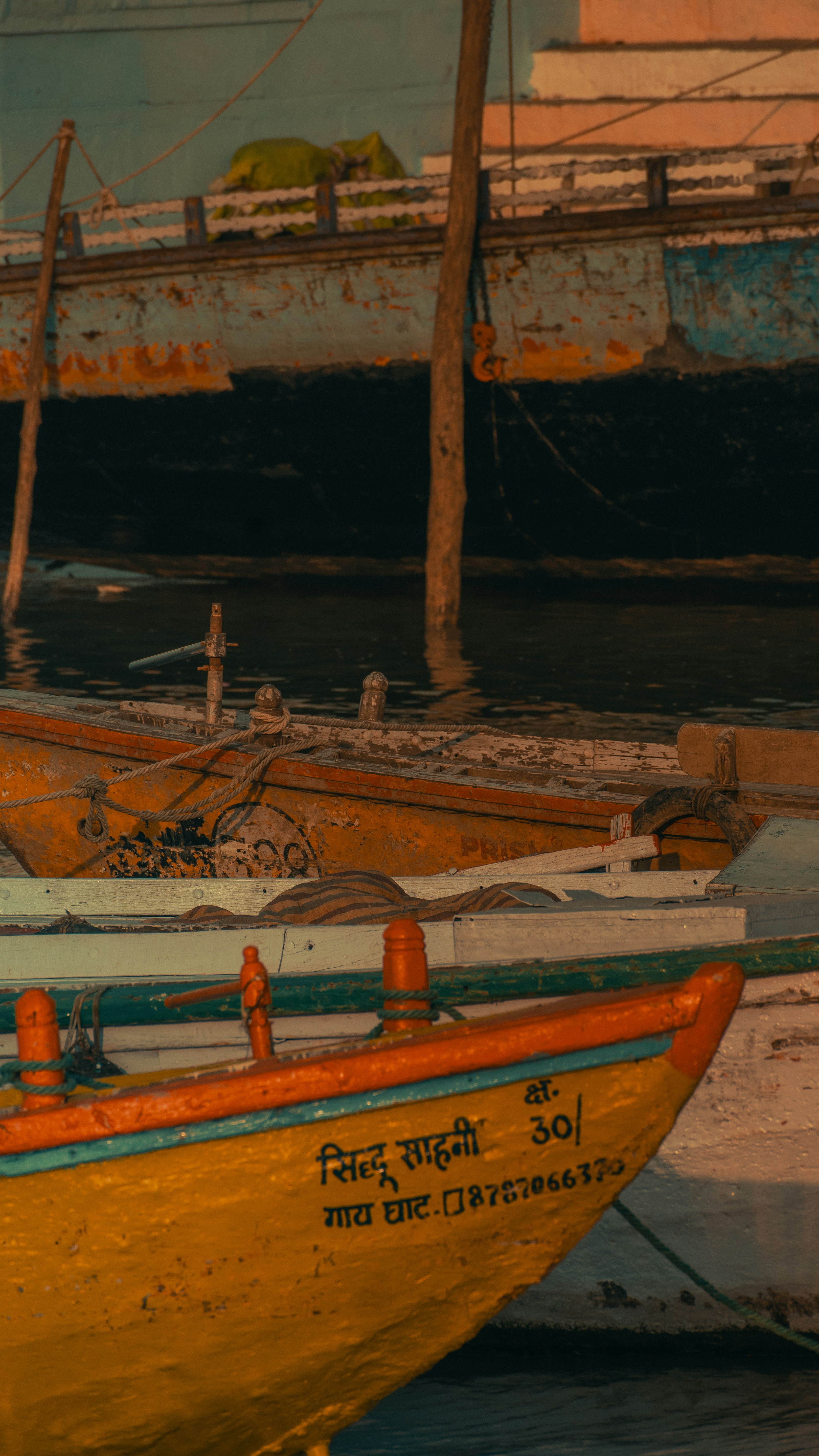 A couple of boats that are sitting in the water