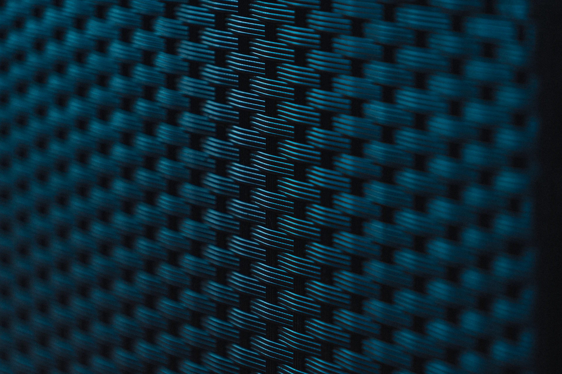 A close up view of the texture of a blue fabric