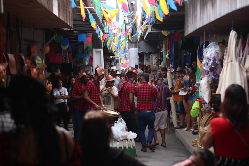 A crowd of people walking down a narrow street