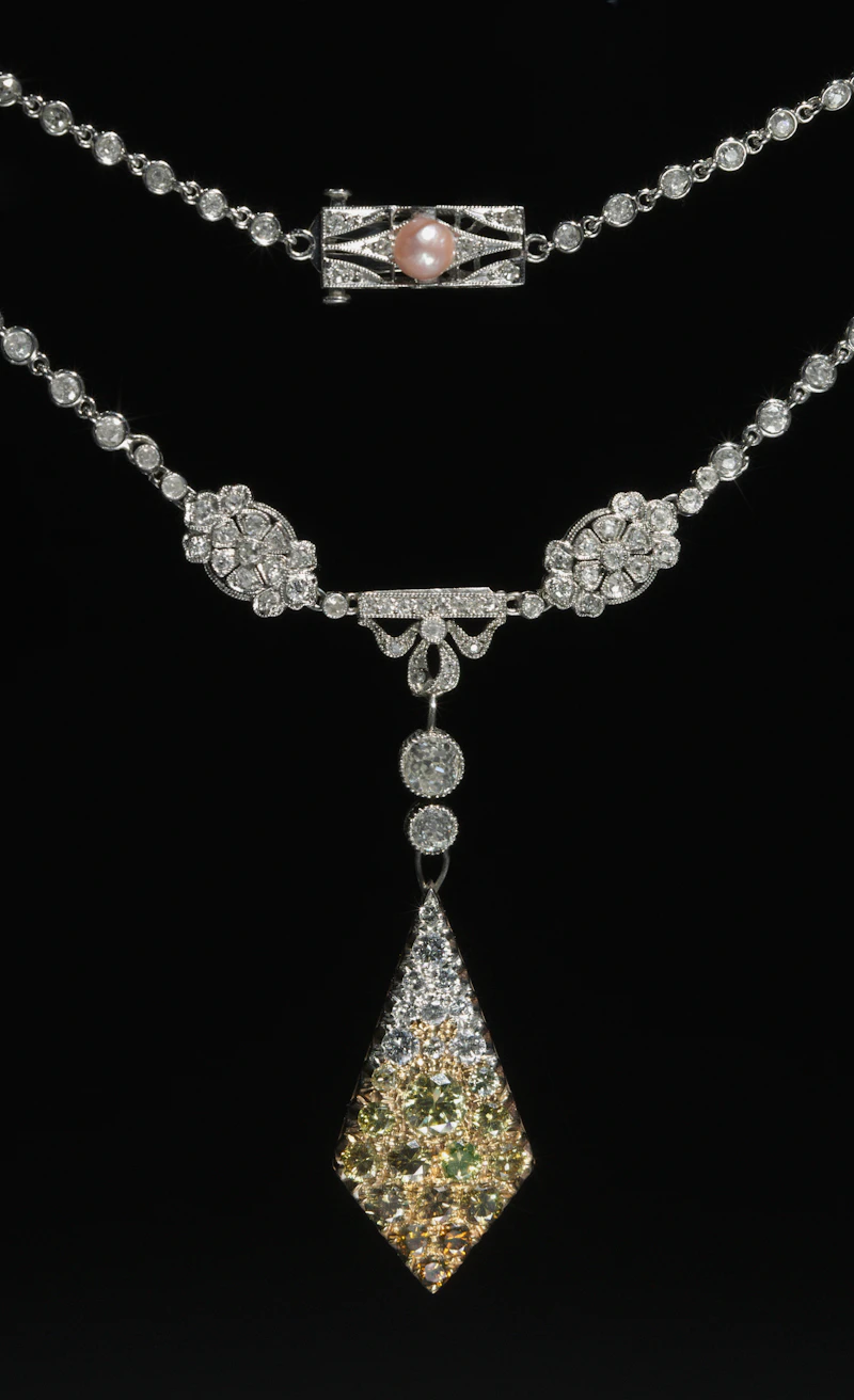 Vintage-inspired diamond riviera necklace with a drop centerpiece on black velvet