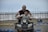 A man and a child riding on a motorcycle