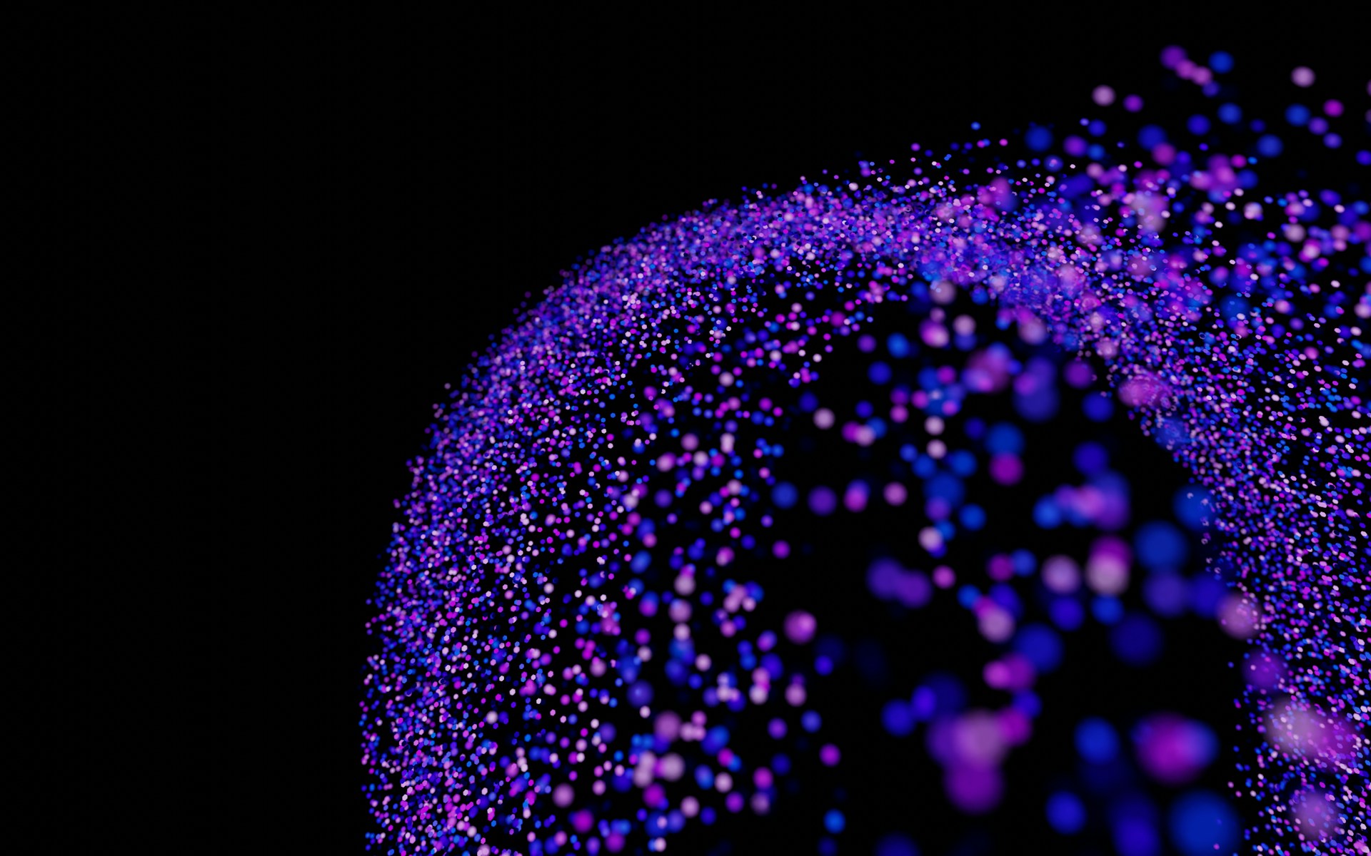 A black background with purple and blue speckles