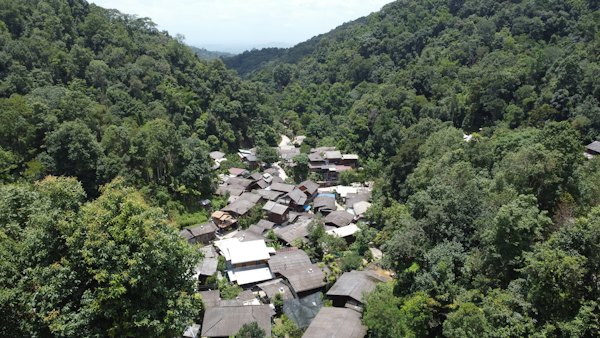 An aerial view of a village in the middle of a forest — Chiang Mai, Thailand