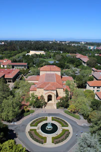 An aerial view of a campus with a fountain