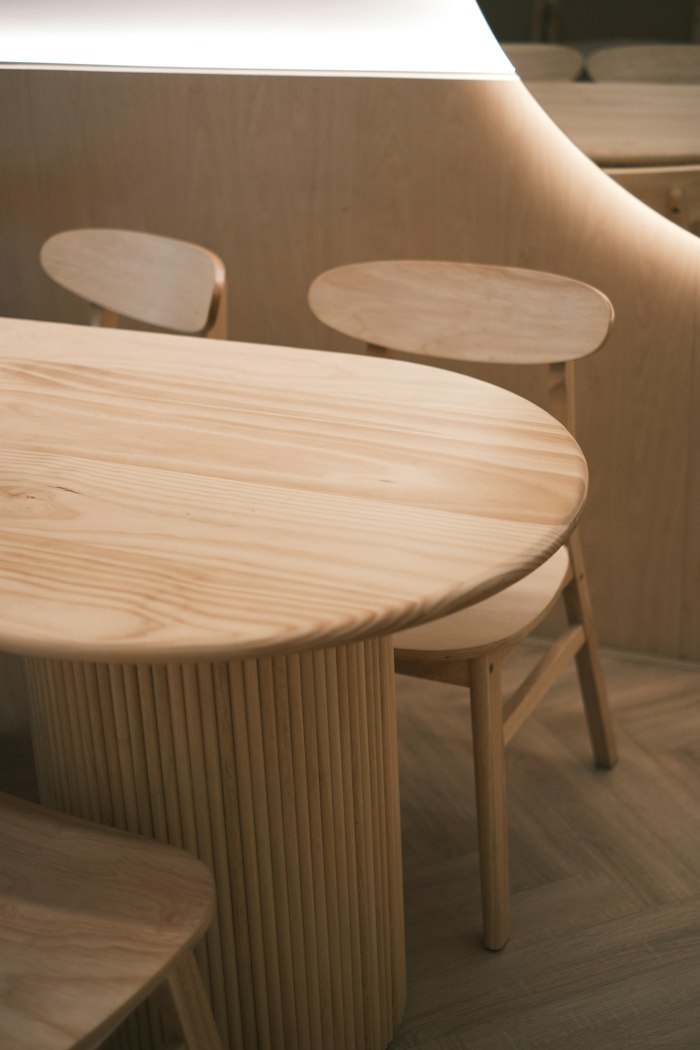Modern wooden dining table and chairs in a room