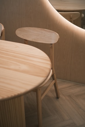 A wooden table and chairs in a room