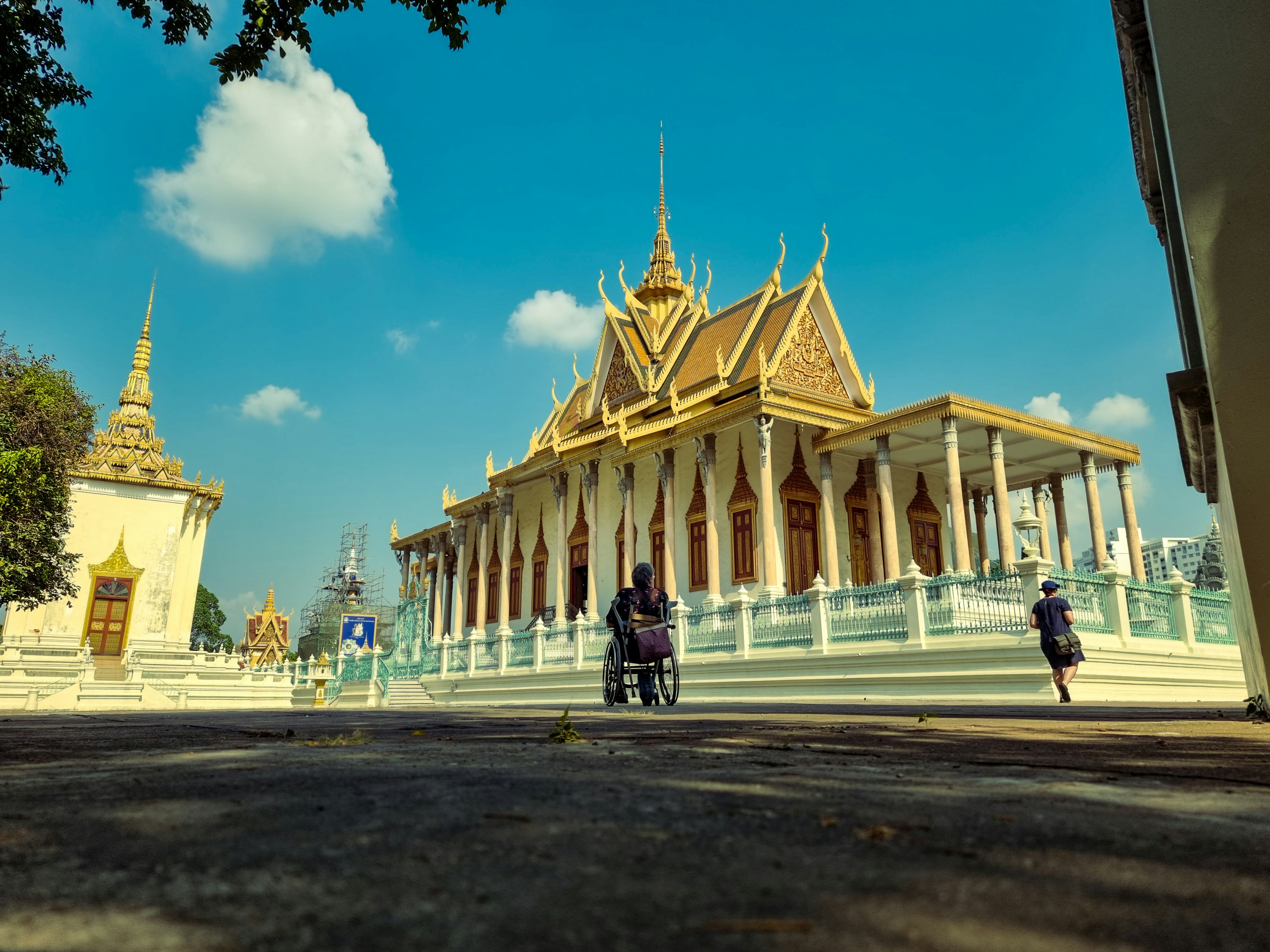 Two people standing in front of a large building
