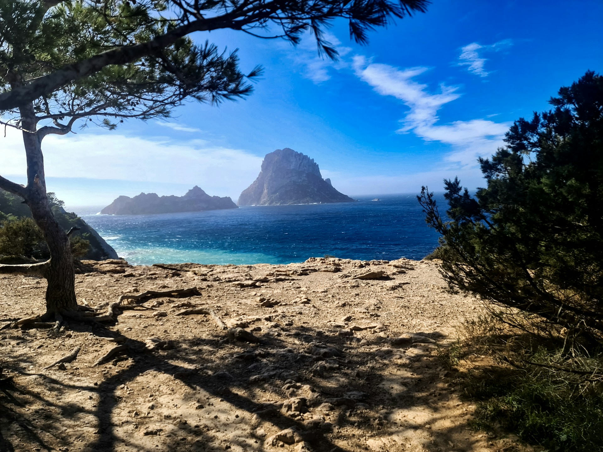A scenic view of a beach with a mountain in the background