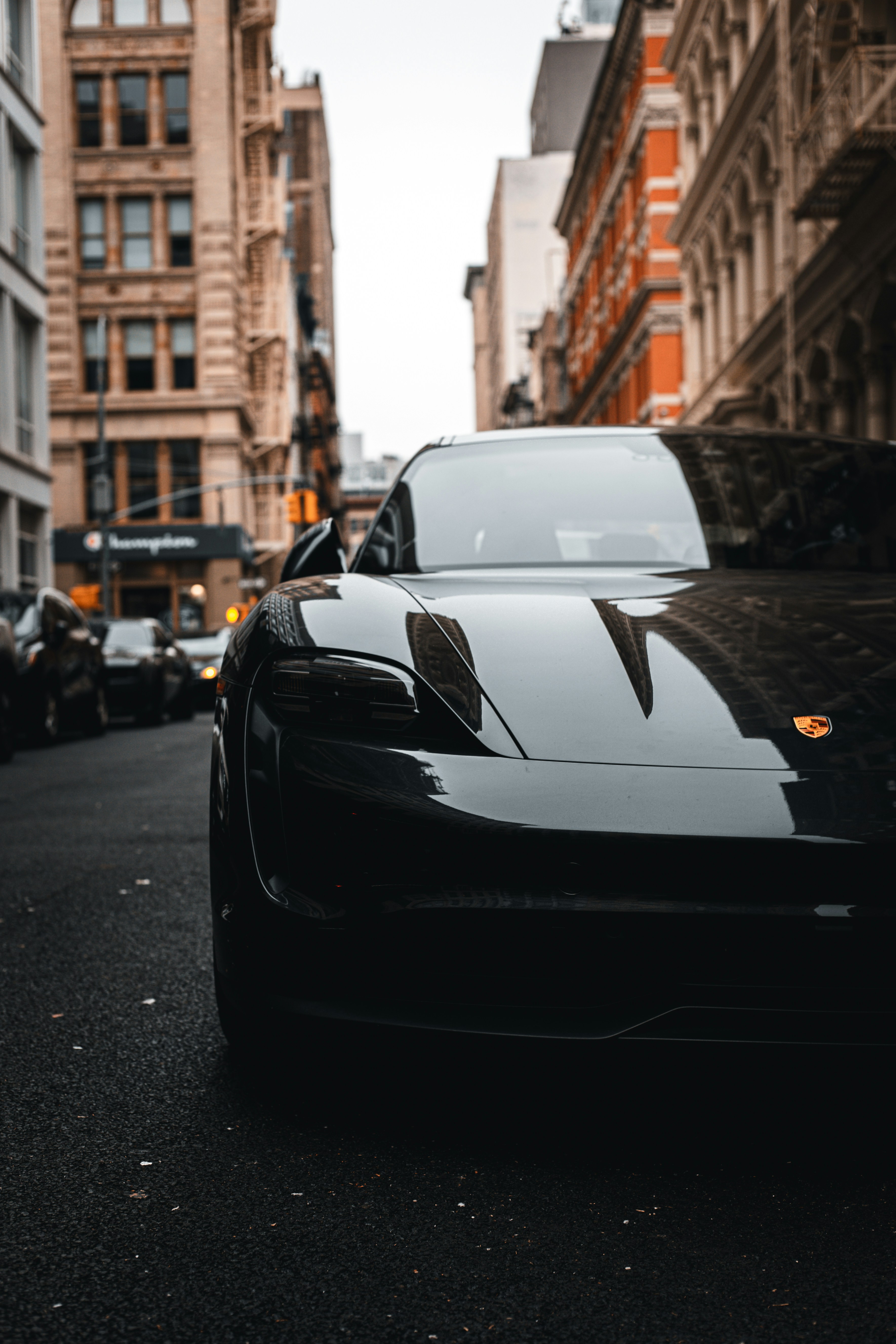A black sports car parked on the side of the road