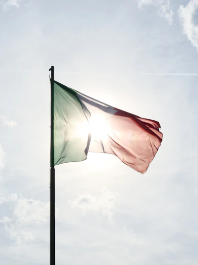 A flag flying in the wind on a sunny day
