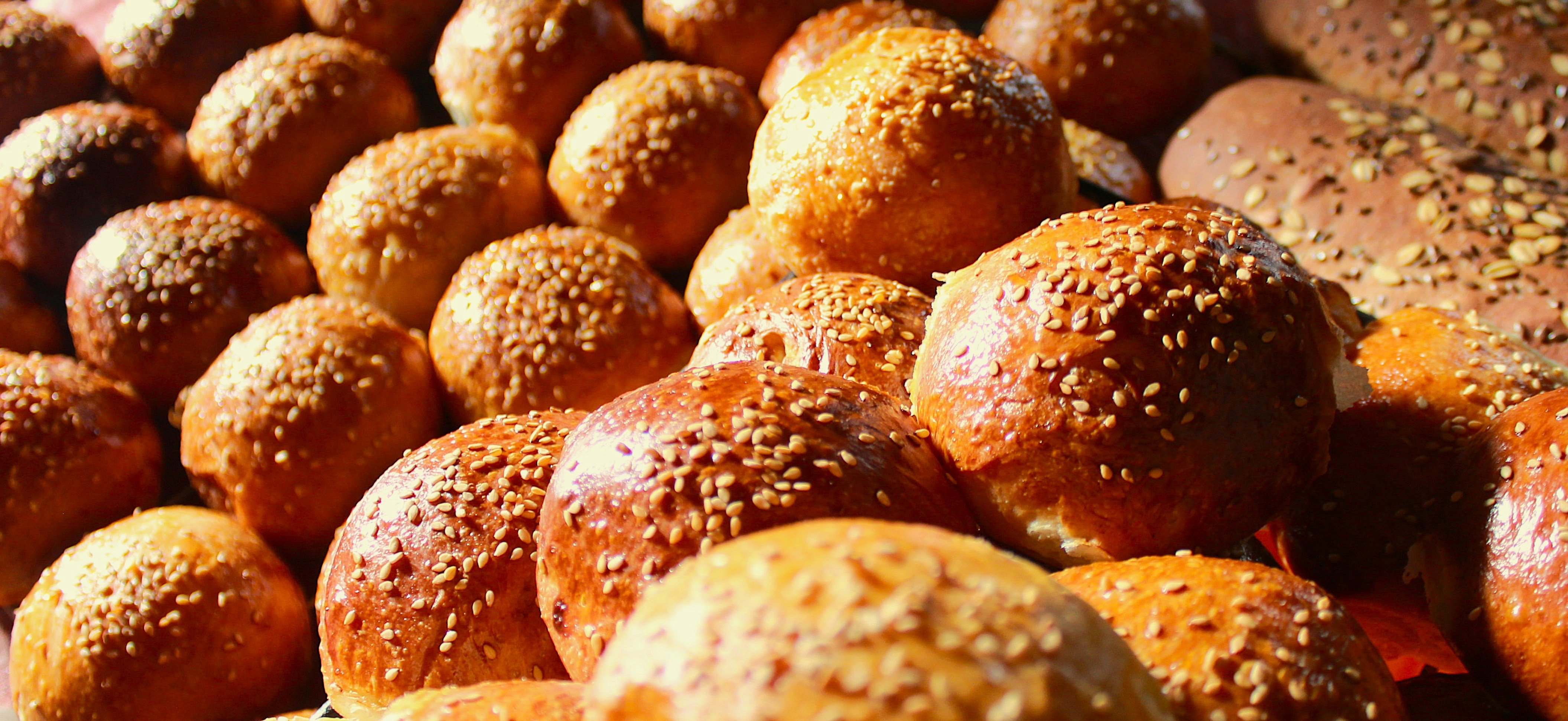 A bunch of different types of bread on display