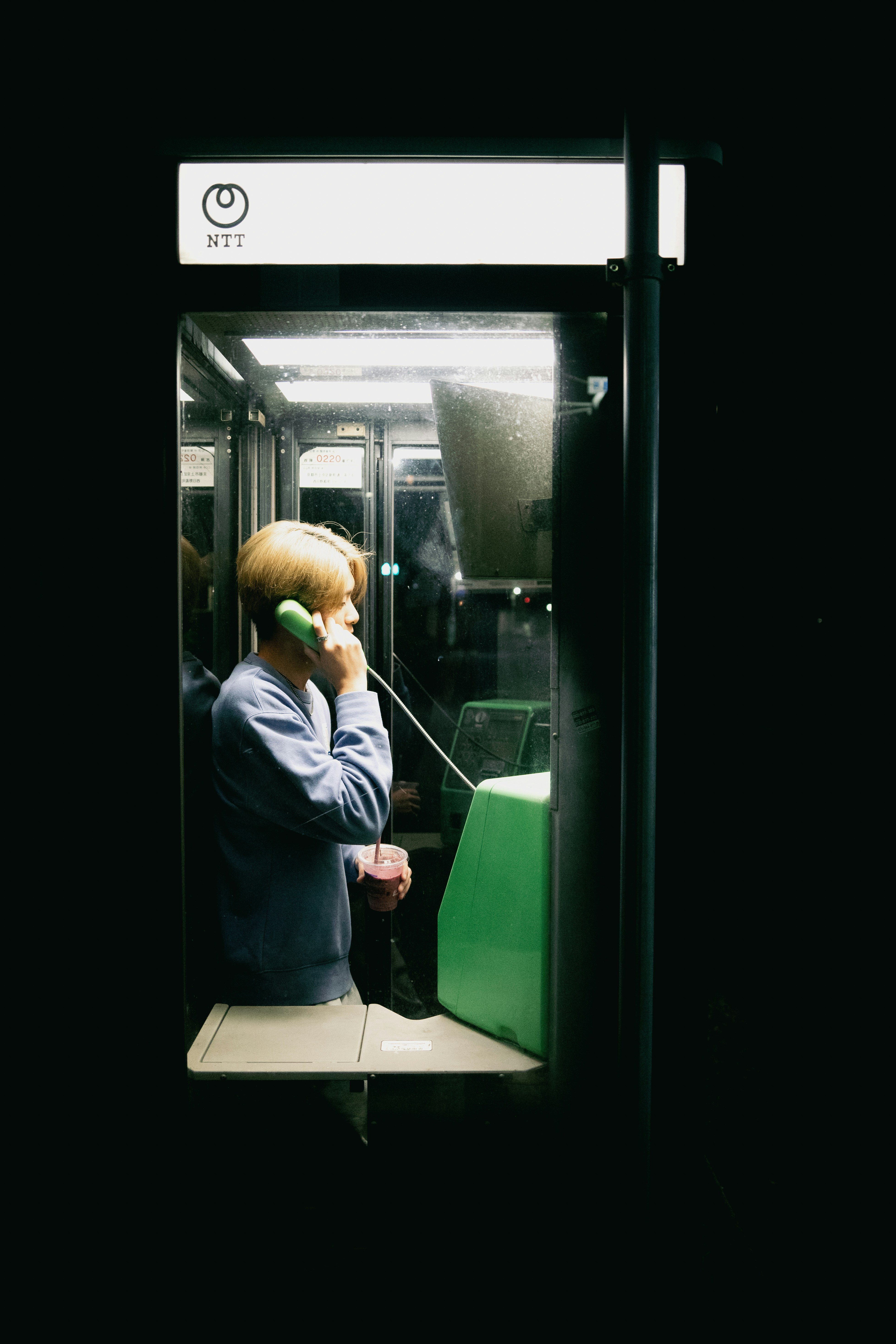 A man talking on a cell phone while riding a bus