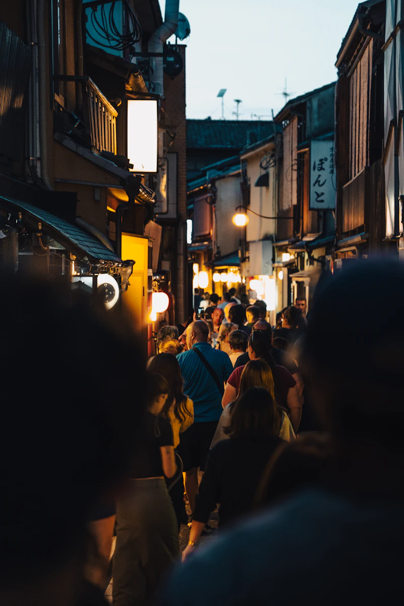 Crowd walking on a city street at night