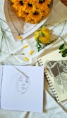 A drawing of a woman and a sunflower on a sheet of paper