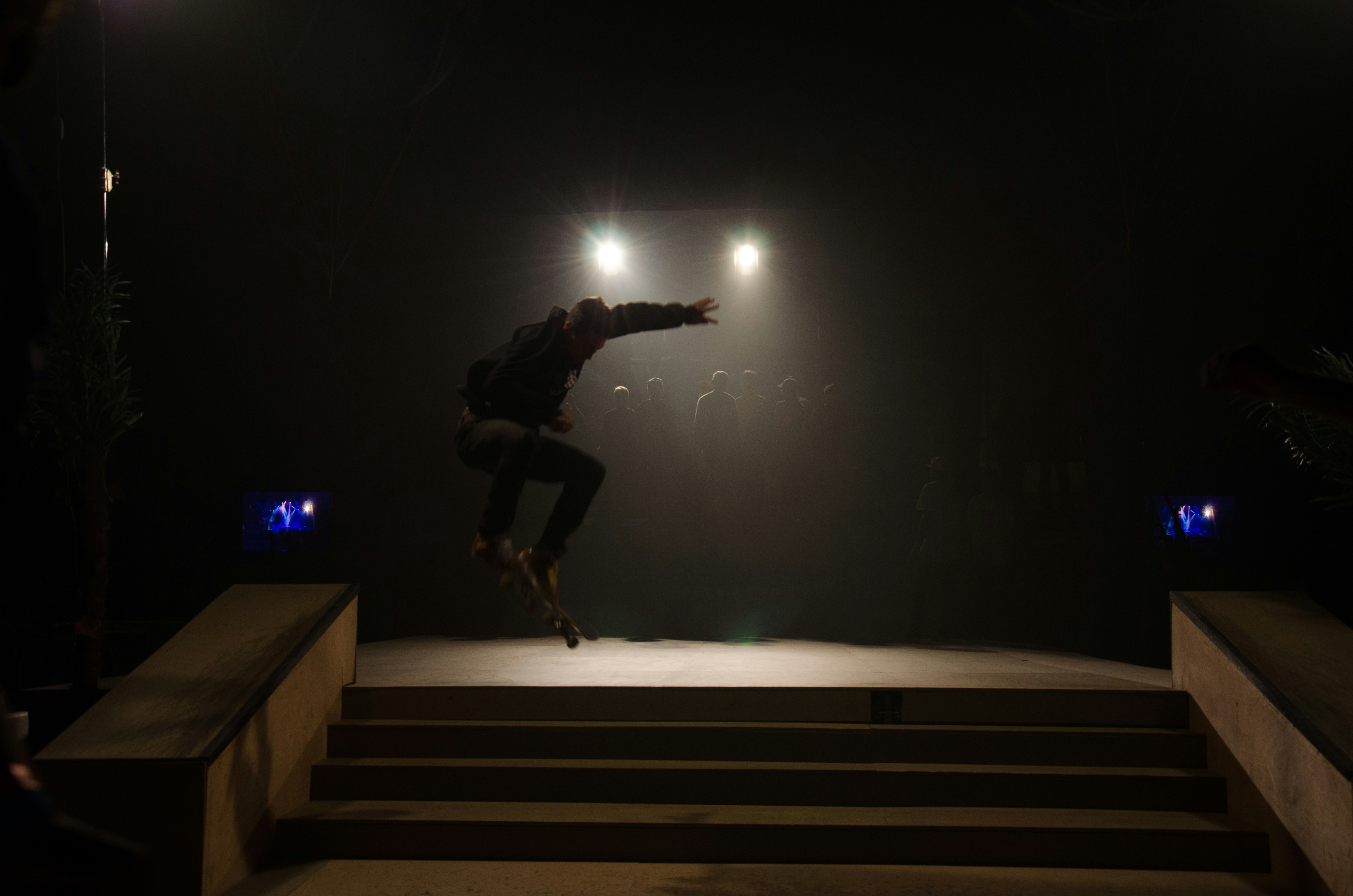 A person jumping in the air on some stairs