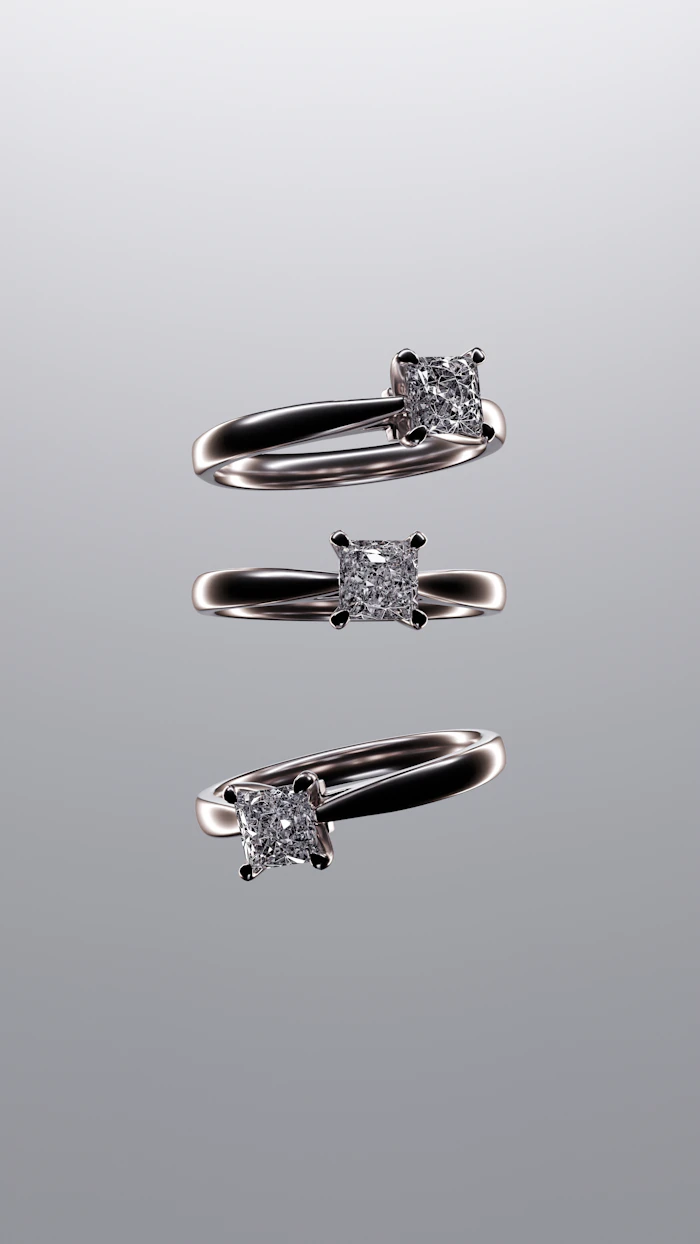 Three silver solitaire rings with square-cut stones