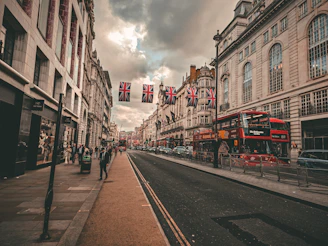 A street scene with a double decker bus on the road