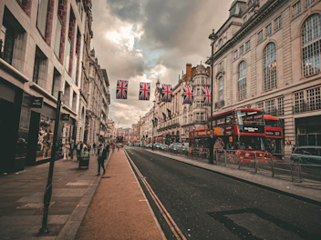 A street scene with a double decker bus on the road