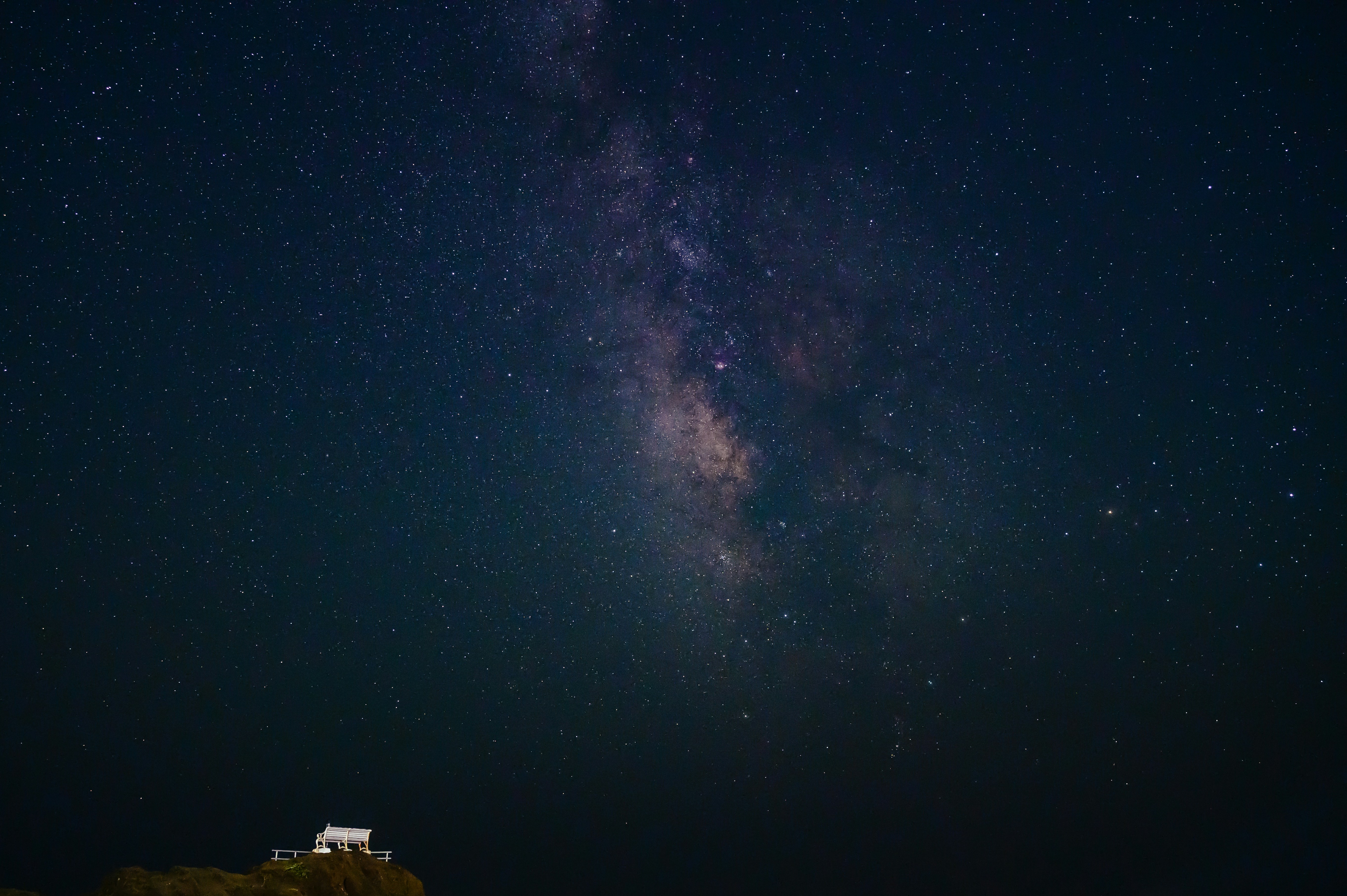 The night sky is filled with stars and the milky shines brightly