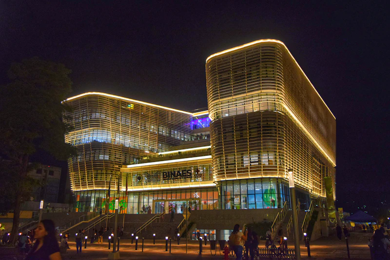 An evening gathering outside a lit building
