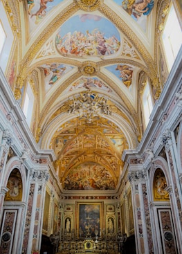 A large cathedral with a painting on the ceiling