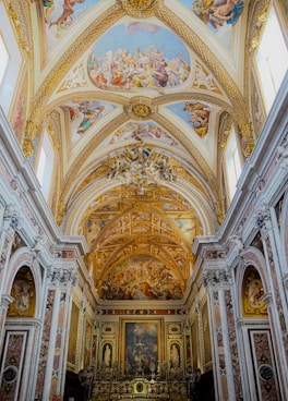 A large cathedral with a painting on the ceiling