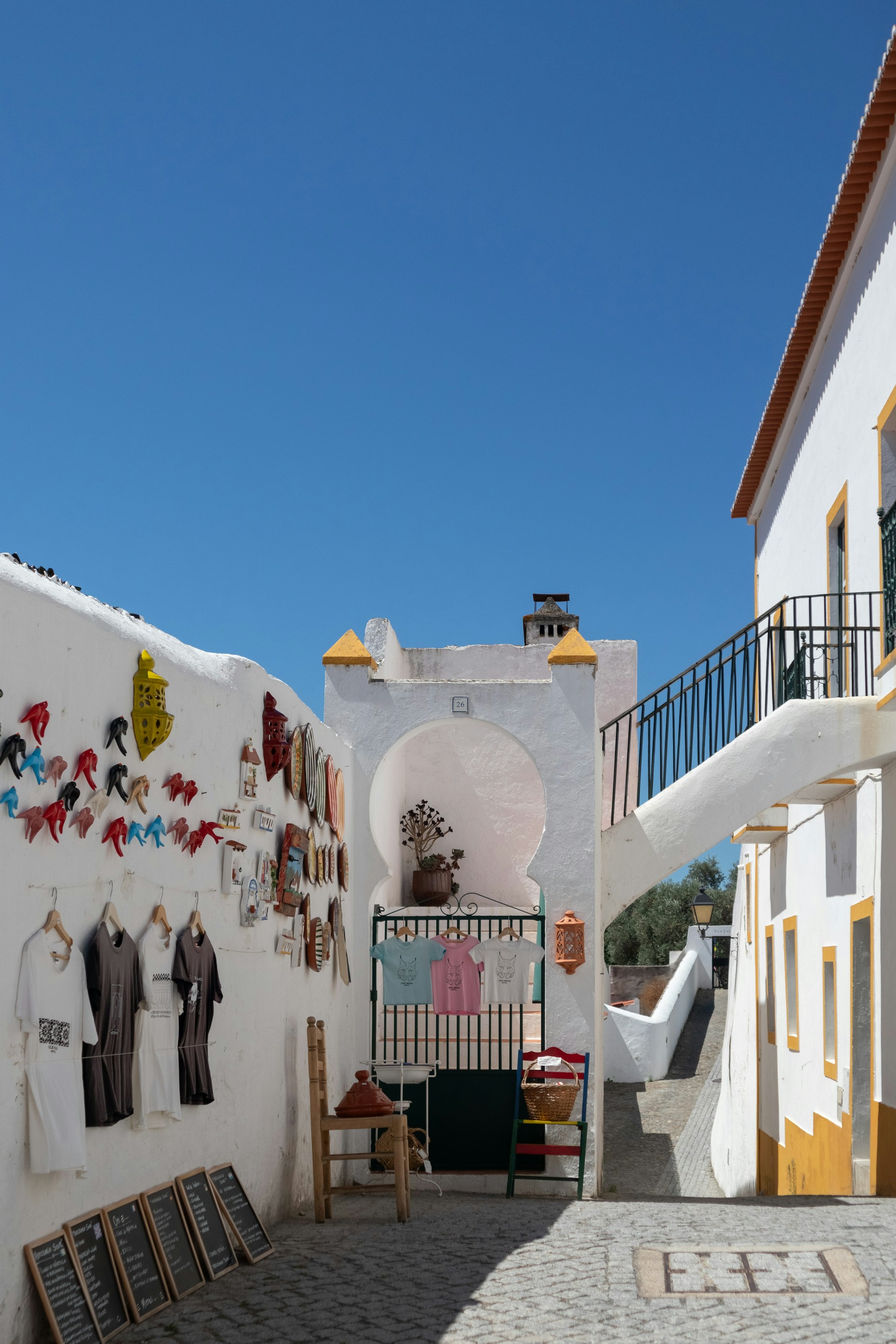 A white building with a bunch of pictures on the wall