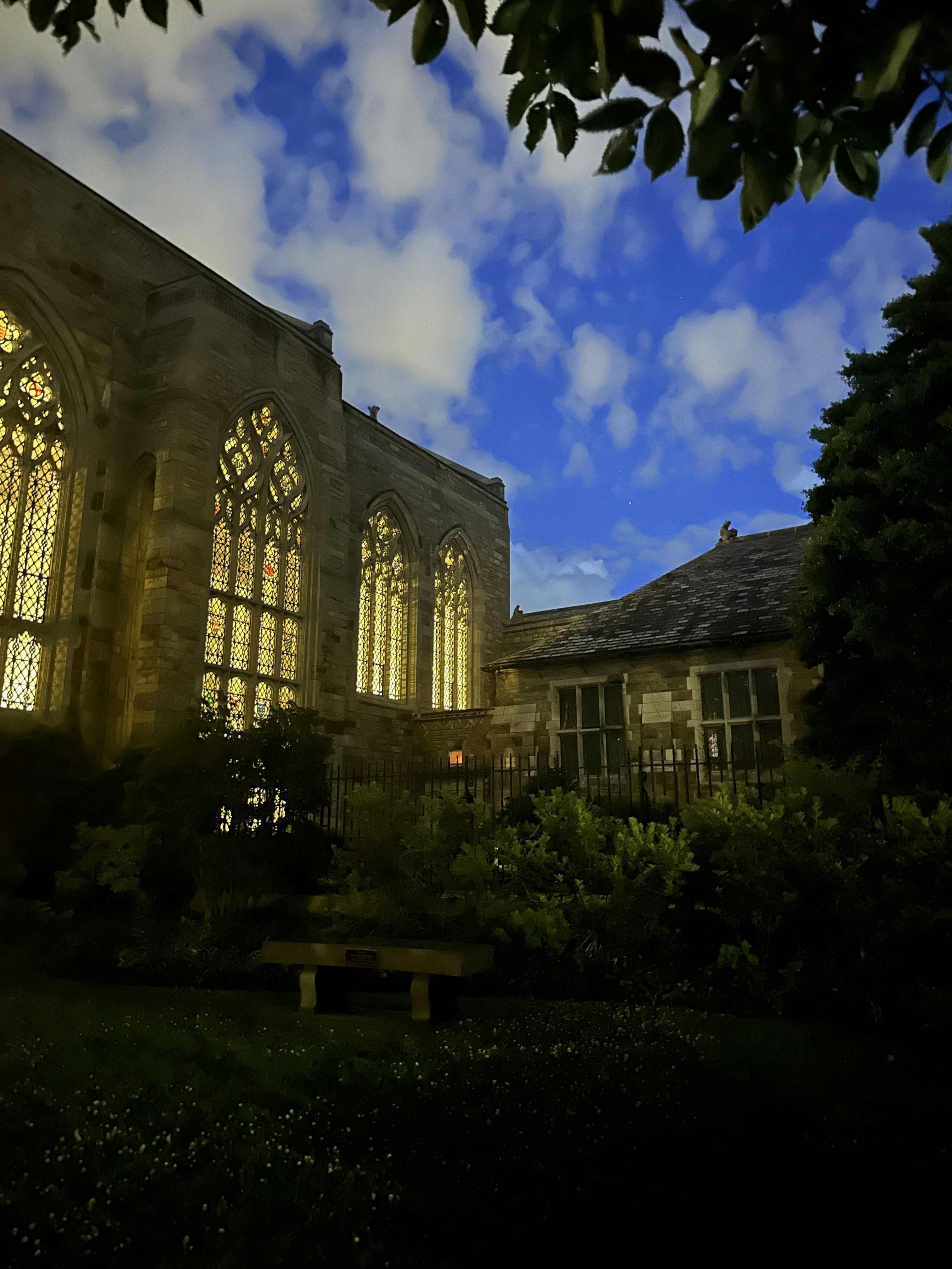 A large building with many windows lit up at night