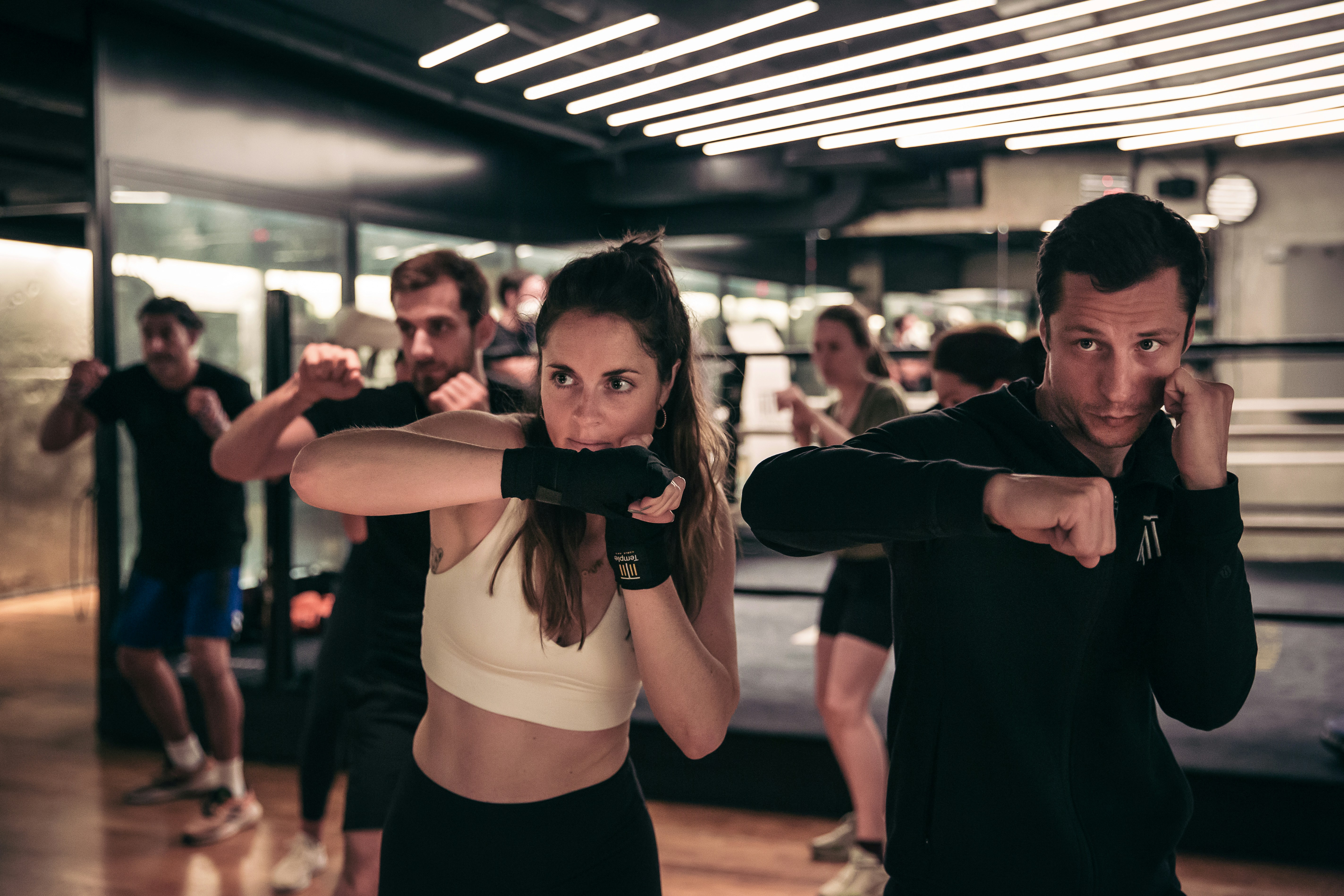 A man and a woman standing in a gym