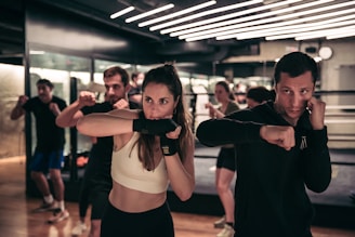 A man and a woman standing in a gym