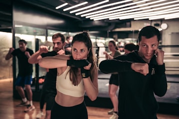 A man and a woman standing in a gym