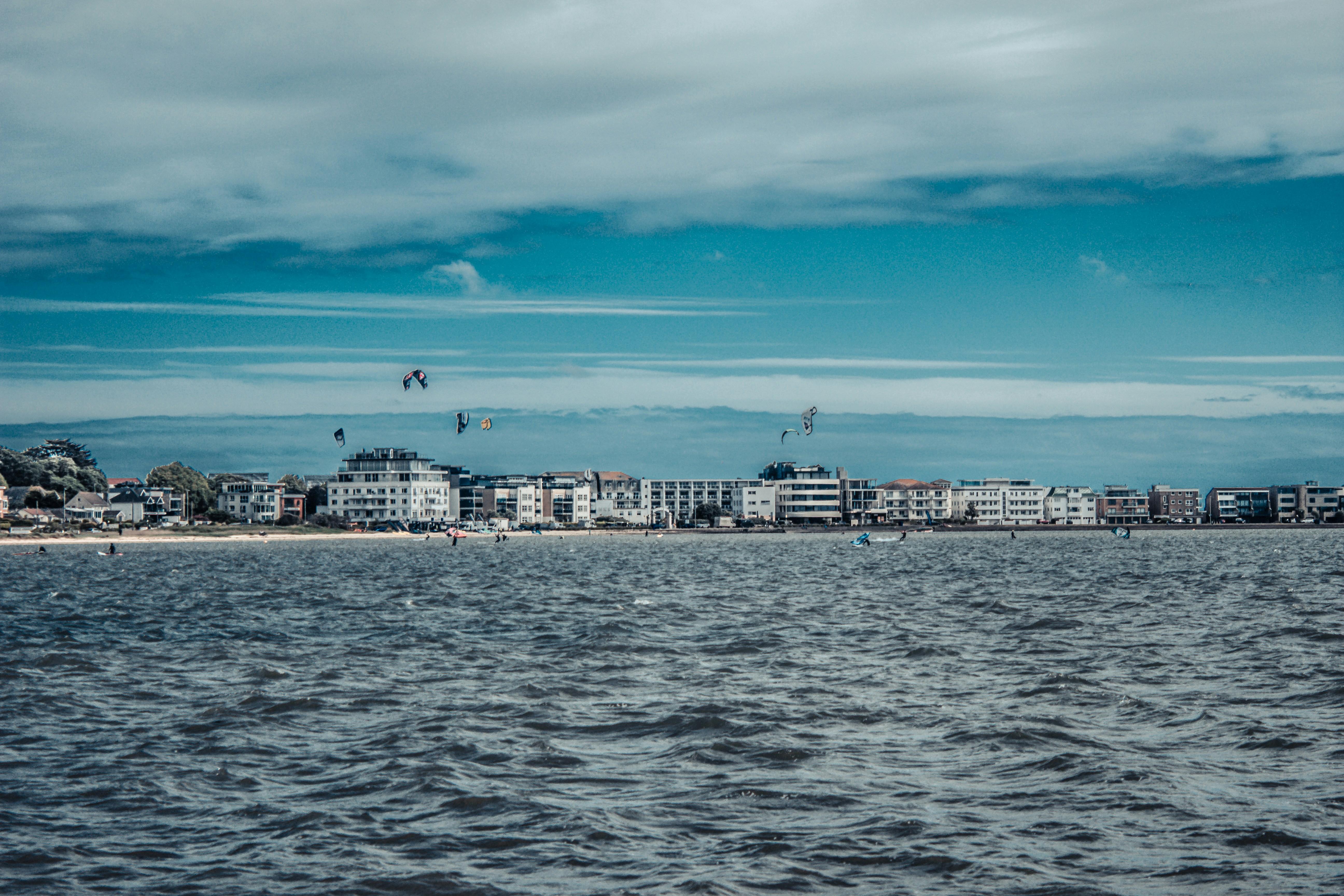 A large body of water with a city in the background