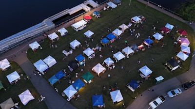An aerial view of a tent set up in a parking lot