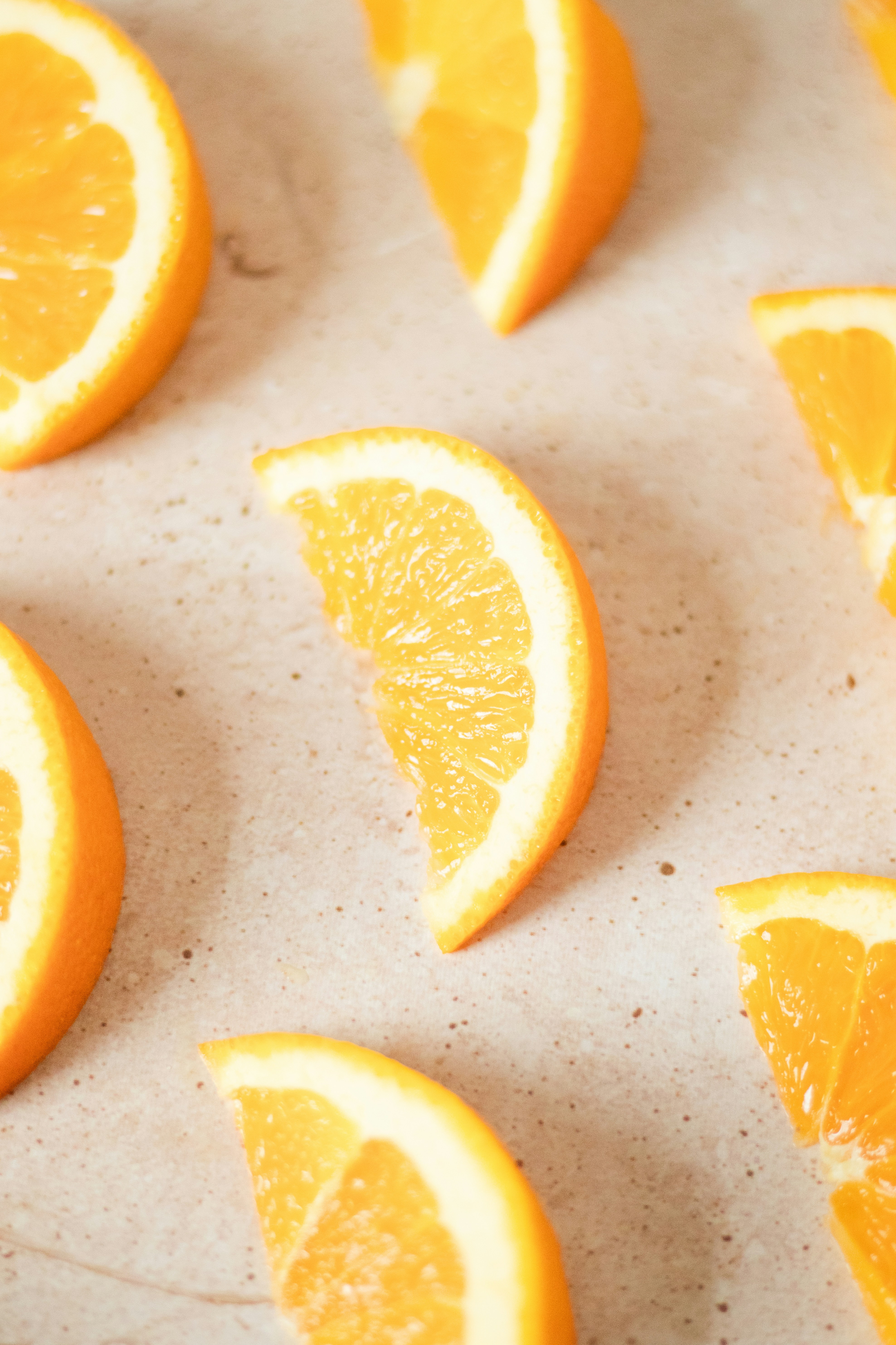 A bunch of oranges sitting on top of a counter