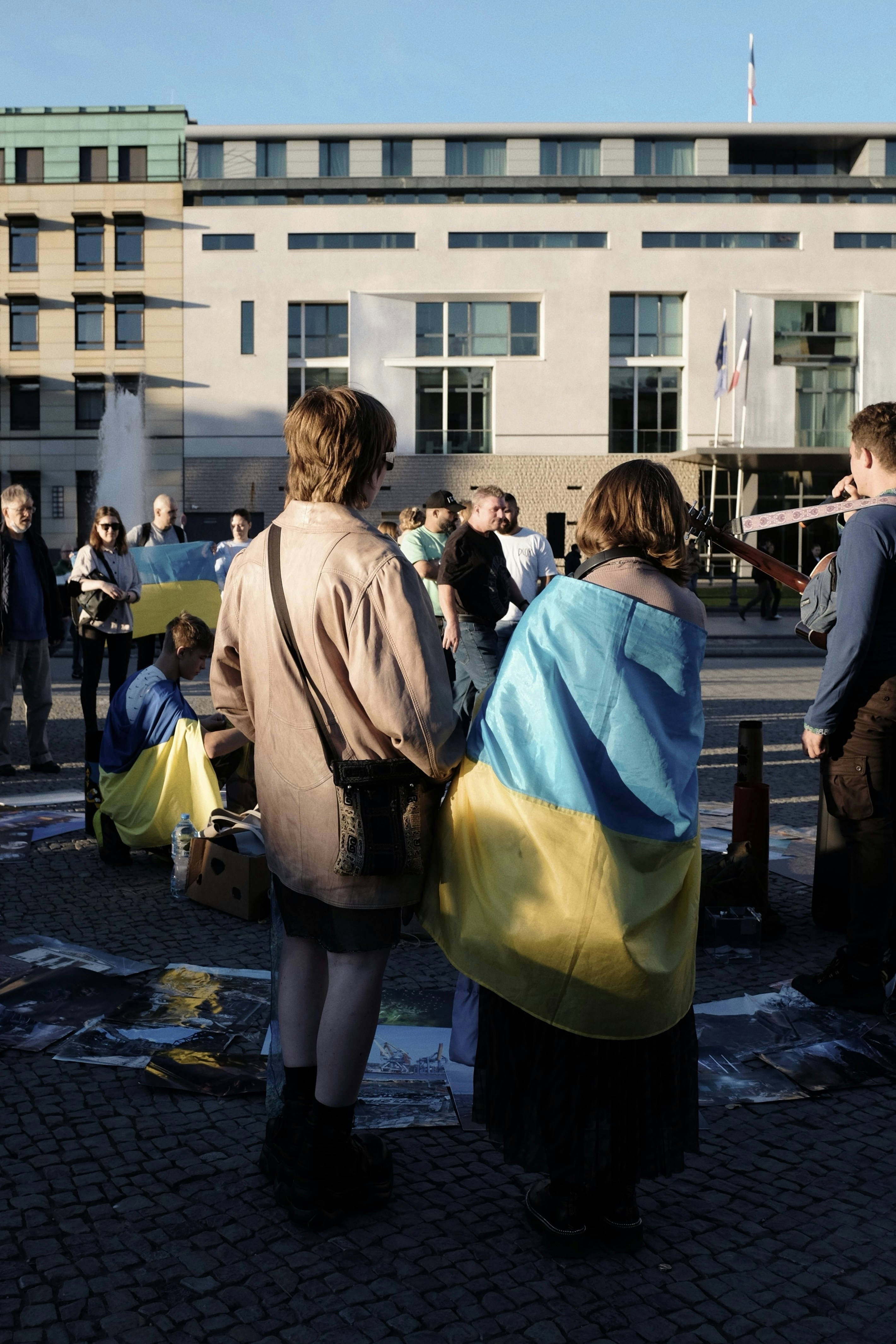 A group of people standing in front of a building