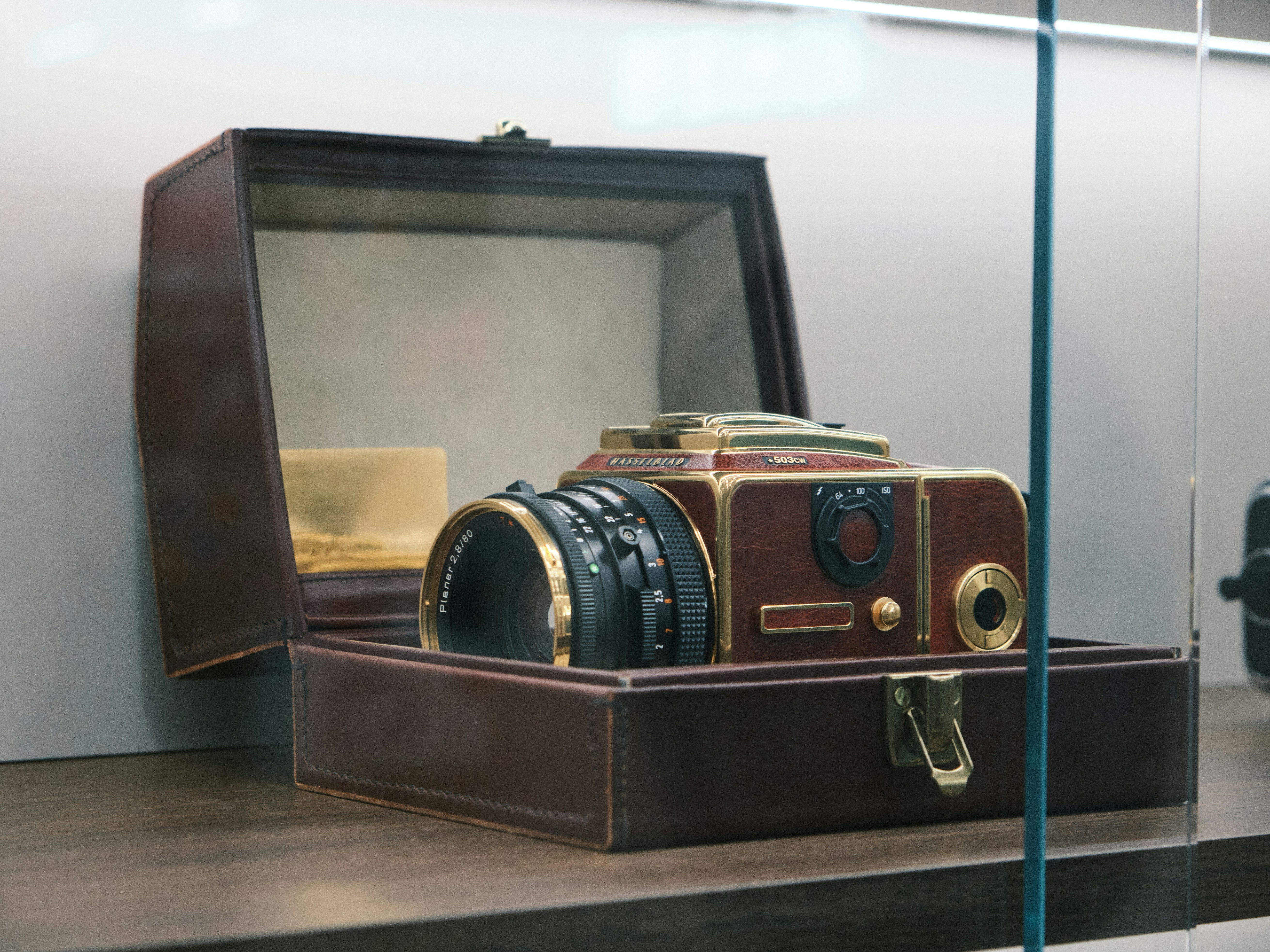 A wooden box with a camera inside of it