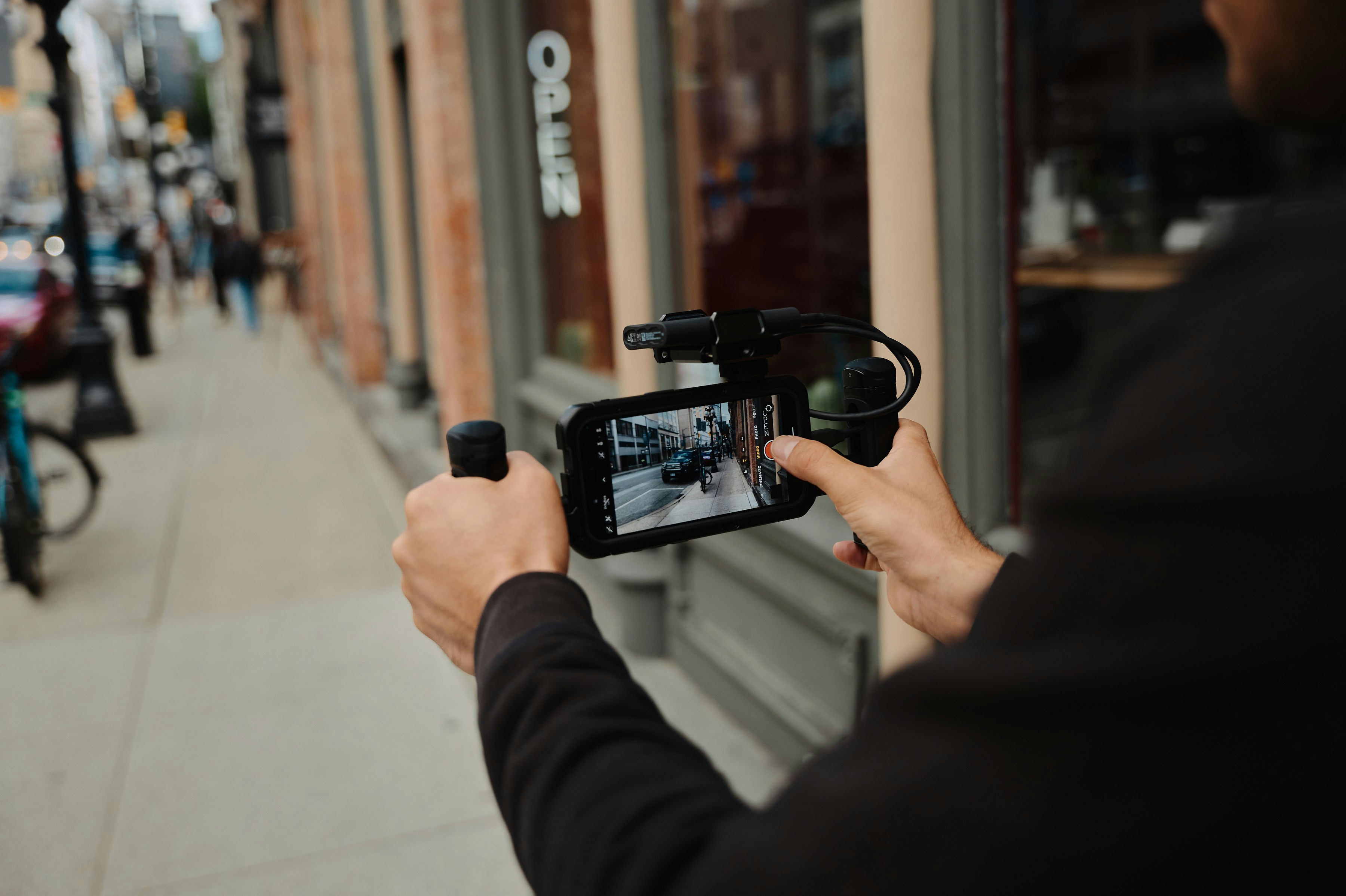 A content creator recording a video for Twitter, he will later investigate Twitter copyright music rules