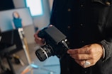 A man holding a camera in his hands