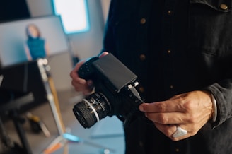 A man holding a camera in his hands