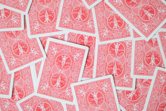 A pile of red and white playing cards