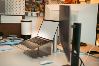 A laptop computer sitting on top of a desk