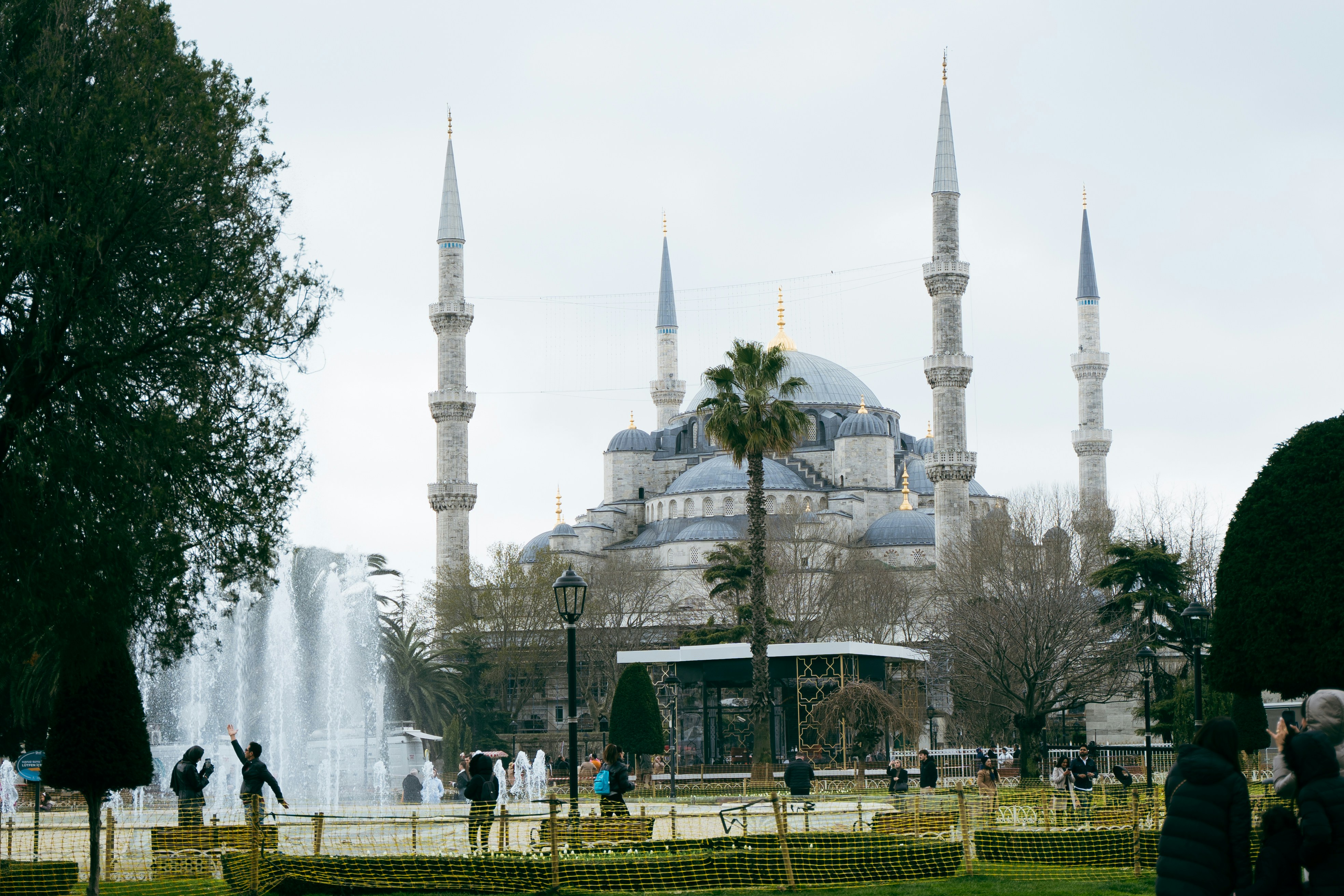 A person taking a picture of a blue mosque