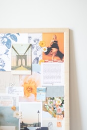 A picture of a wall with a bunch of pictures on it