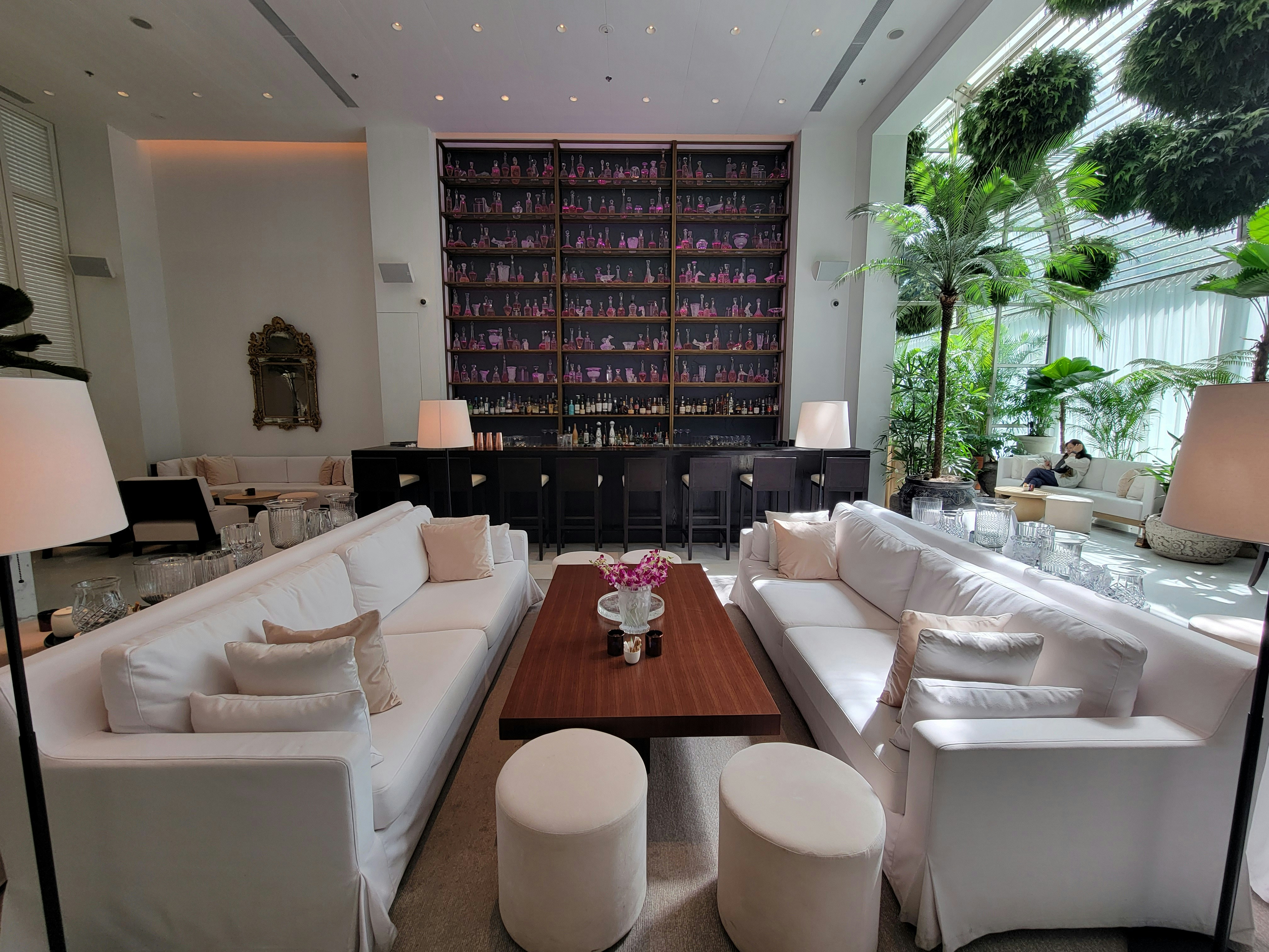 A living room filled with lots of white furniture